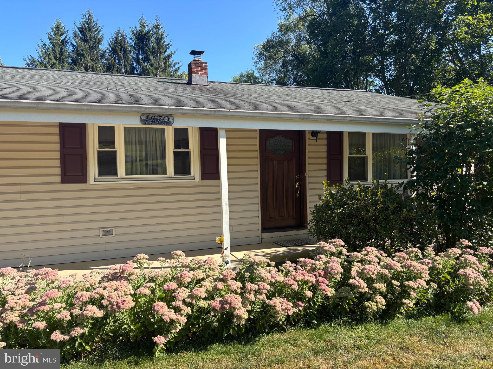 1470 Middle Road Lewistown, PA 17044 - Photo 10 of 13 Charming home with vibrant garden blooms.