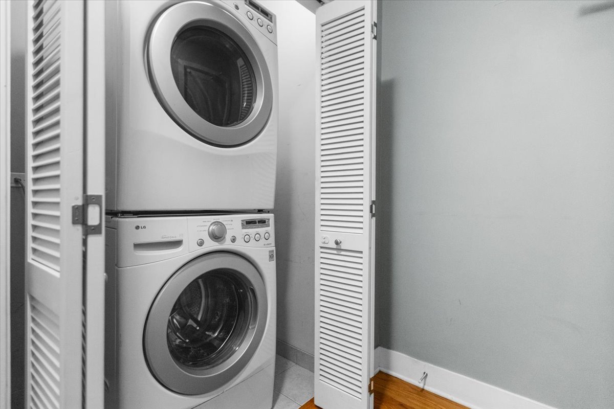 207 East 31st Street, Unit 5B Chicago, IL 60616 - Photo 9 of 10 a view of a hallway with washer and dryer