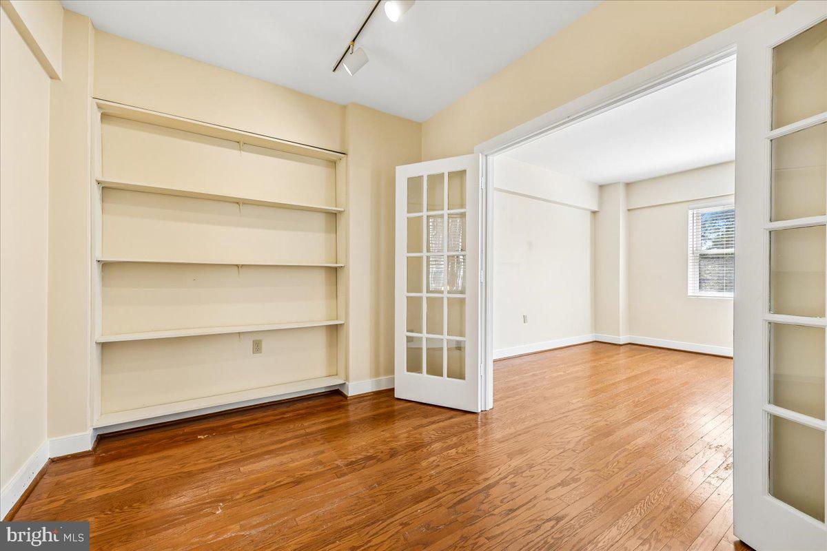 1727 R Street Northwest, Unit 201 Washington, DC 20009 - Photo 14 of 49 Den/Office with built-in shelves & french doors