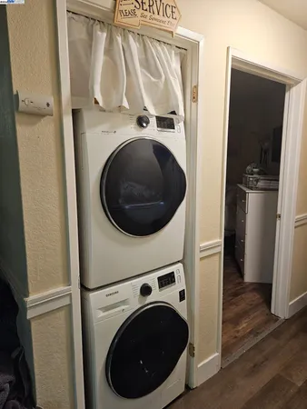 a view of a hallway with washer and dryer