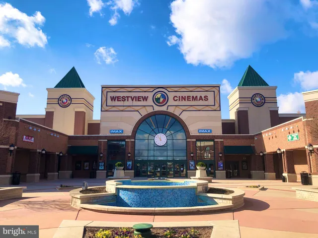 a swimming pool with outdoor seating and yard