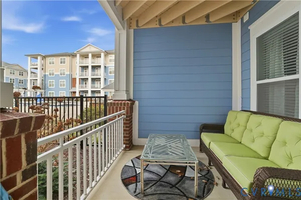 a view of a balcony with furniture