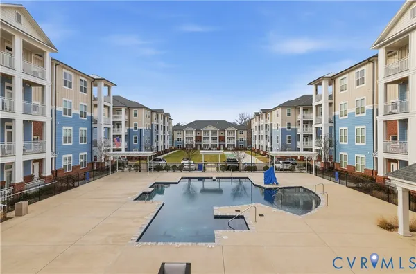 a view of roof with a barbeque grill and city view