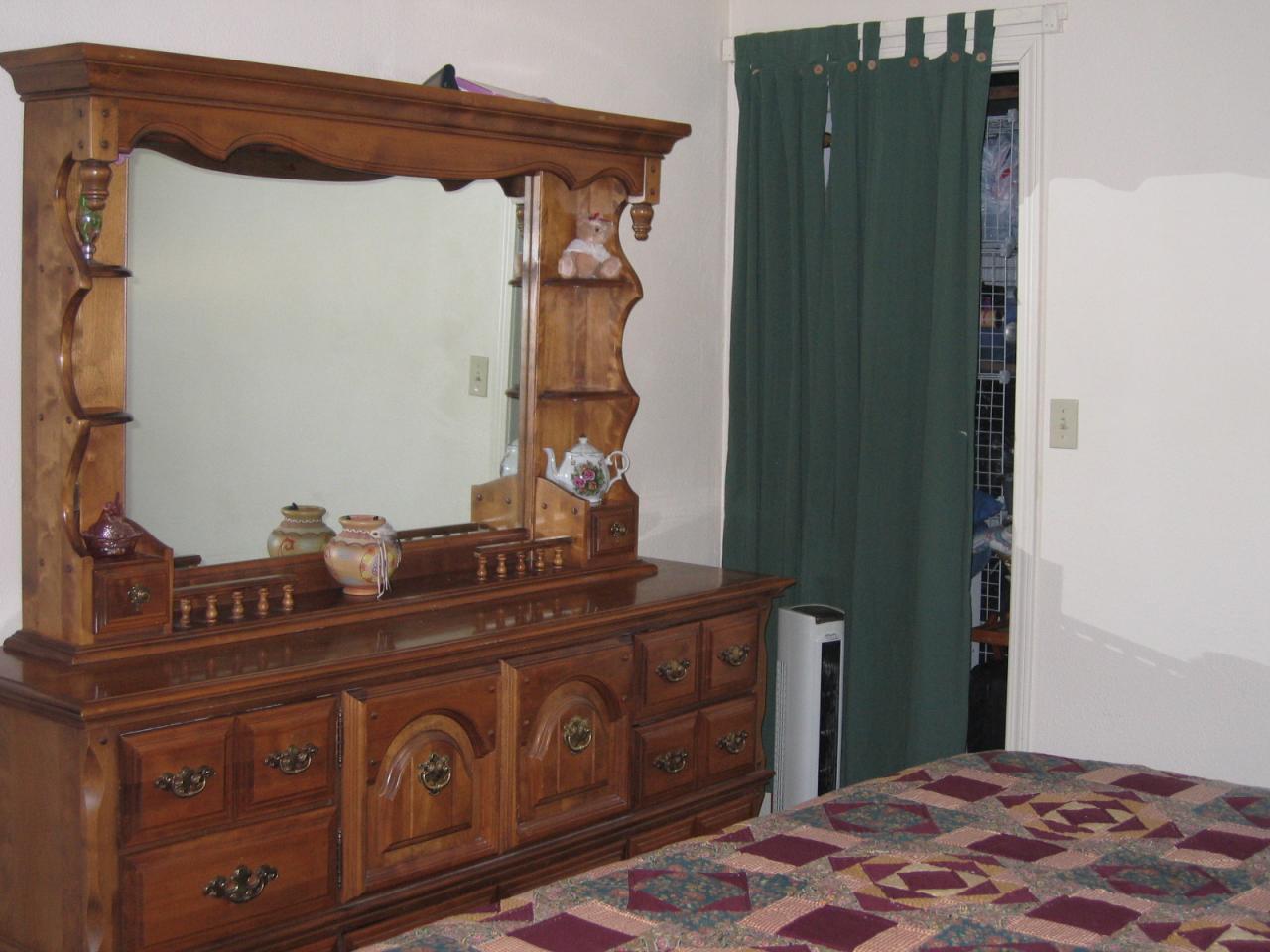 11554 Quartz Hill Road Redding, CA 96003 - Photo 22 of 28 a bedroom with a bed and cabinets