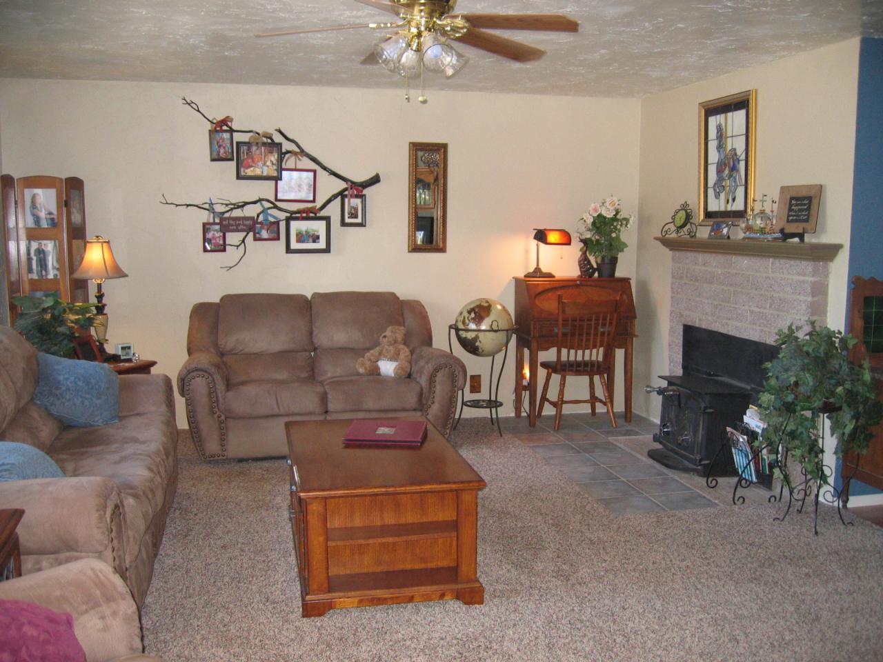 11554 Quartz Hill Road Redding, CA 96003 - Photo 9 of 28 a living room with furniture and a fireplace