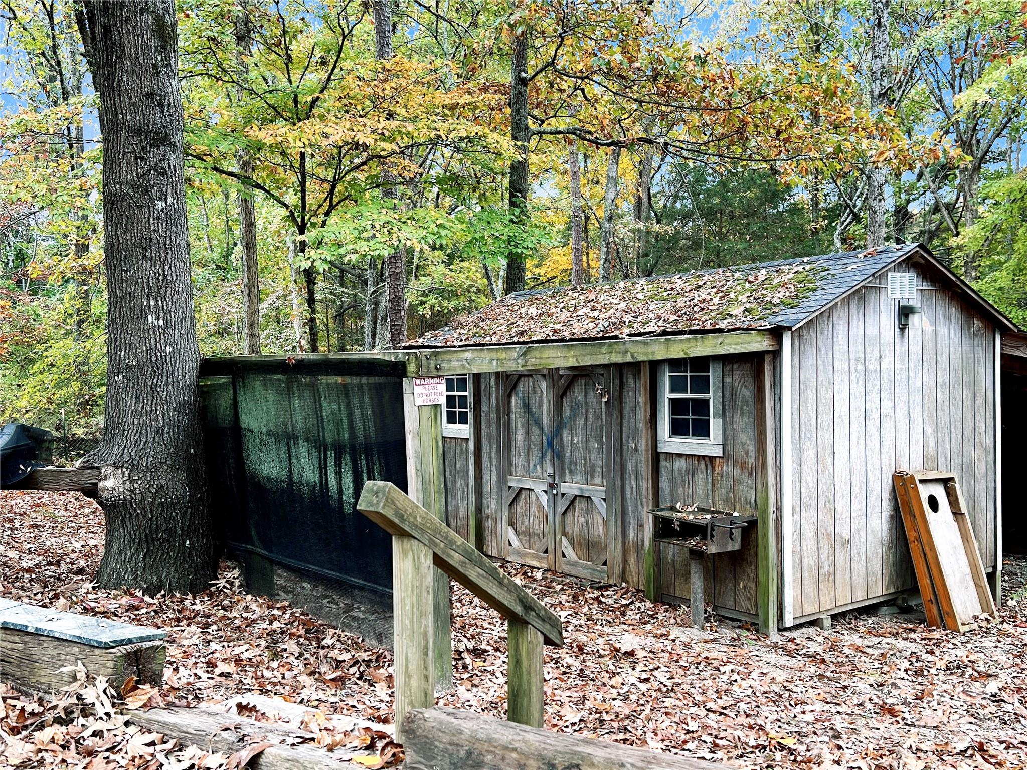 2814 Hart Road Clover, SC 29710 - Photo 25 of 28 a view of a wooden house with a yard and large tree