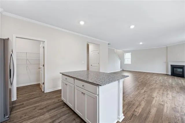 a kitchen with stainless steel appliances granite countertop a sink and cabinets