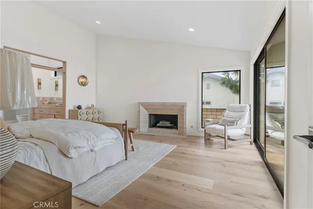 a bed room with a bed and a fireplace