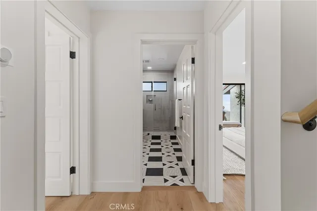 a bedroom with a large bed and a large window