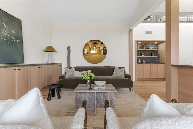 a large white kitchen with a large window