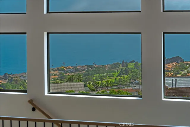 a front view of a house with a garden and porch