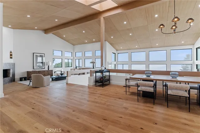a living room with lots of furniture and kitchen view