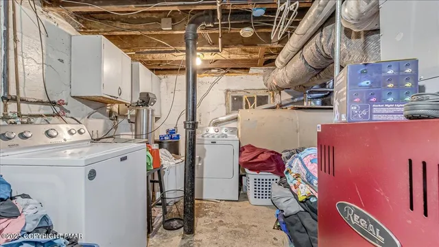 a view of a door of the house with a bench