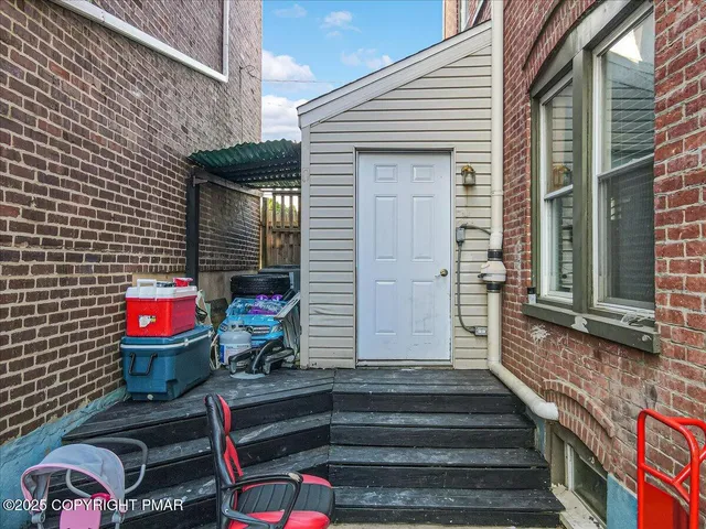 a front view of a house with stairs