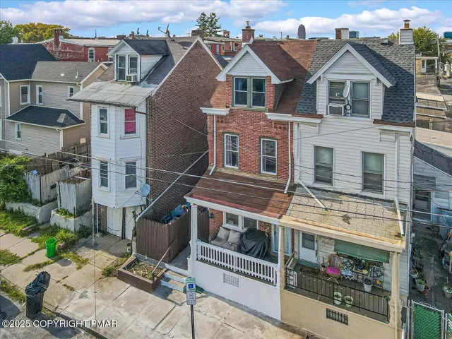 an aerial view of houses and roads