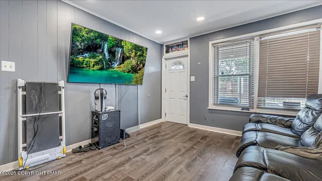 a view of a livingroom with furniture and a window