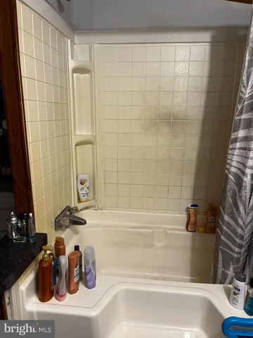 a bathroom with a sink and a bathtub