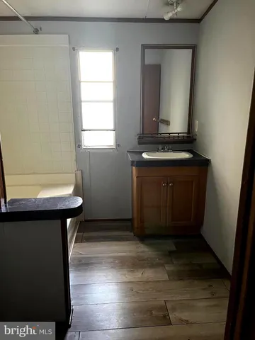 a room with a window and a mirror