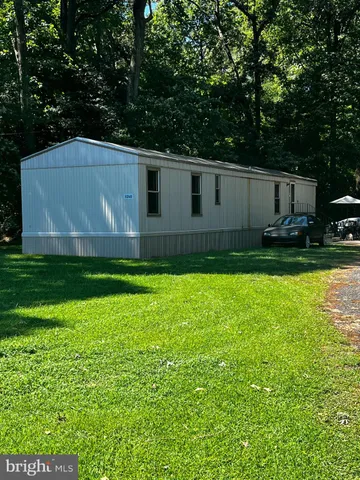 a view of a backyard of the house