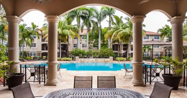 an outdoor space with lots of furniture and garden view