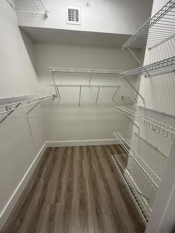 a view of a room with racks on the wall