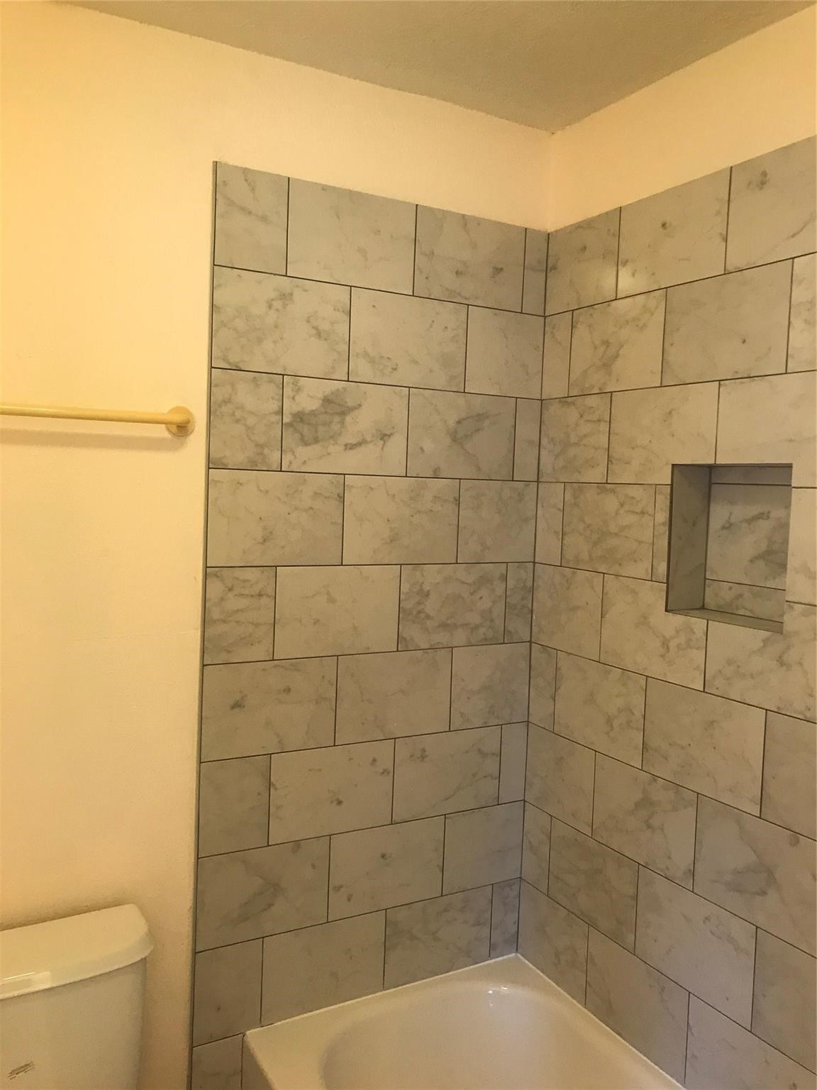 8646 Maplecrest Drive Houston, TX 77099 - Photo 12 of 13 a bathroom with a shower and a toilet
