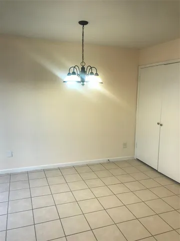 a kitchen with granite countertop a stove a sink and a microwave