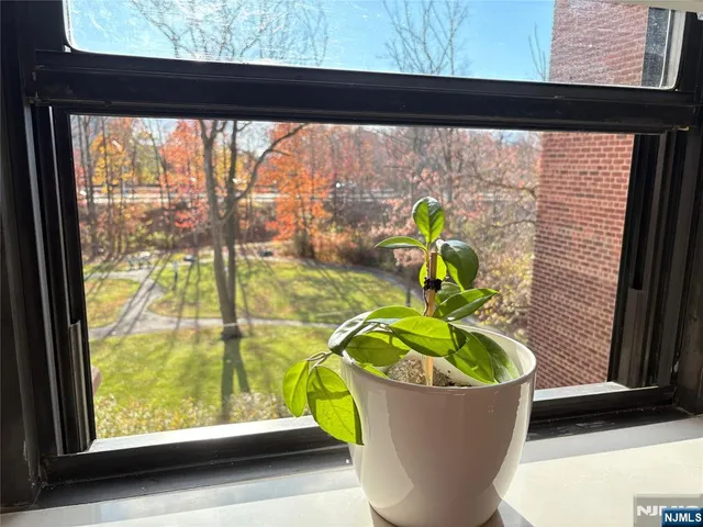 a view of a workspace with furniture and wooden floor