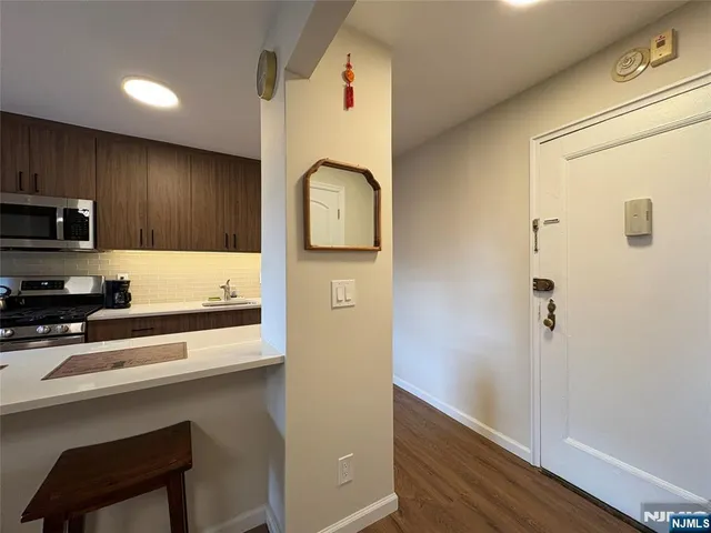 a kitchen that has a sink and a stove