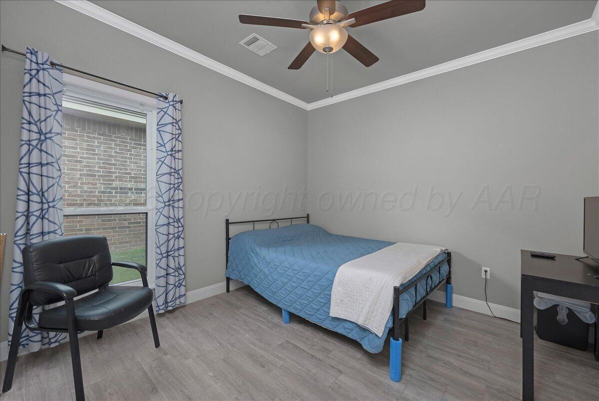 39 Cm Lane Canyon, TX 79015 - Photo 16 of 26 a bedroom with a bed and a chair