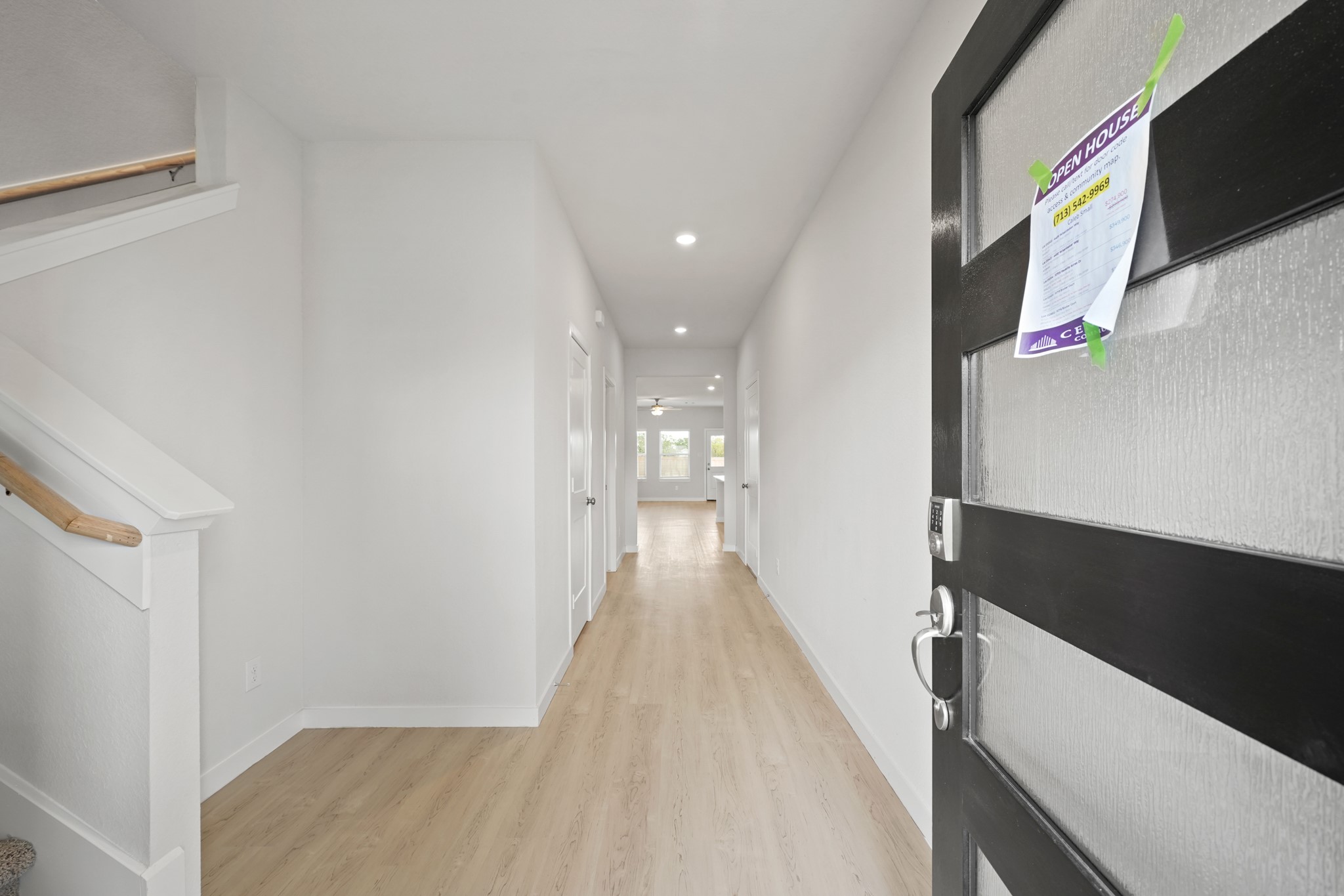 2402 Forshire Road Conroe, TX 77306 - Photo 3 of 24 a view of a hallway with wooden floor