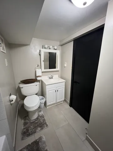 a bathroom with a bathtub and shower