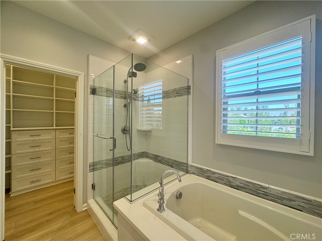 179 Hargrove Irvine, CA 92620 - Photo 12 of 27 a bathroom with a bathtub and a shower