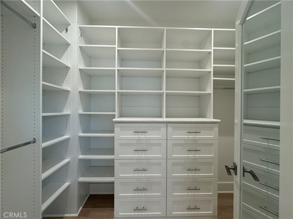 179 Hargrove Irvine, CA 92620 - Photo 13 of 27 a view of walk in closet with empty racks