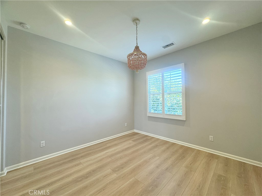 179 Hargrove Irvine, CA 92620 - Photo 14 of 27 an empty room with a window and a ceiling fan