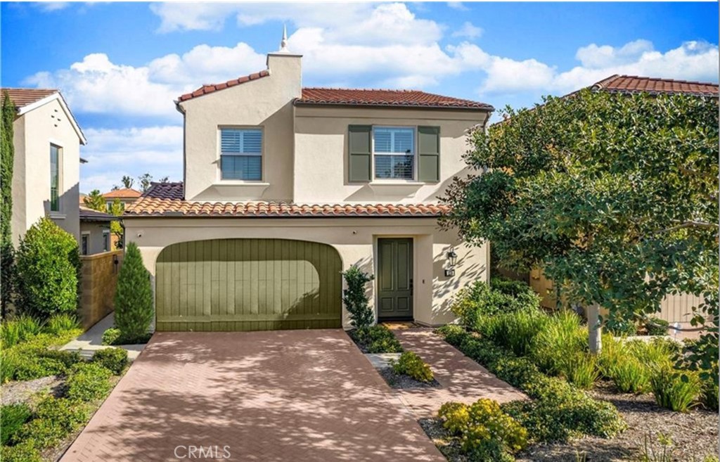 179 Hargrove Irvine, CA 92620 - Photo 2 of 27 a front view of a house with a garden