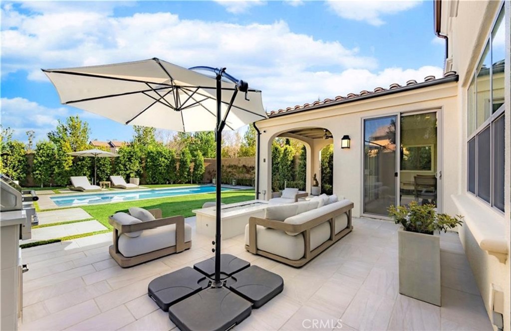 179 Hargrove Irvine, CA 92620 - Photo 22 of 27 a view of a patio with swimming pool table and chairs
