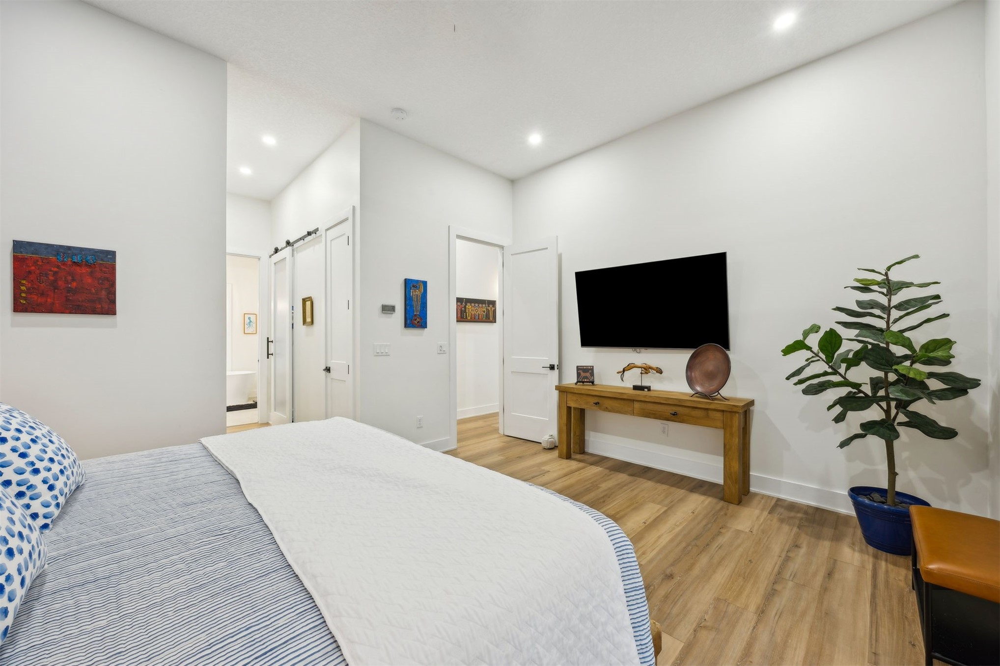 45 Beachwood Road Amelia Island, FL 32034 - Photo 12 of 41 a bedroom with a bed and a flat screen tv