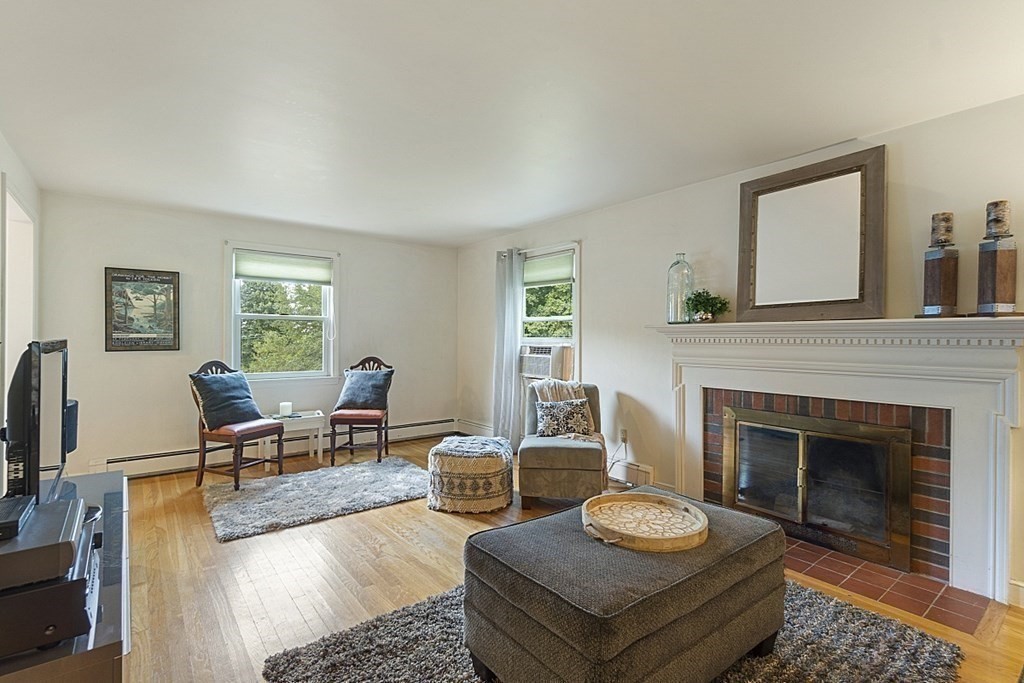 5 Alpine Circle Wakefield, MA 01880 - Photo 11 of 42 a living room with furniture and a fireplace