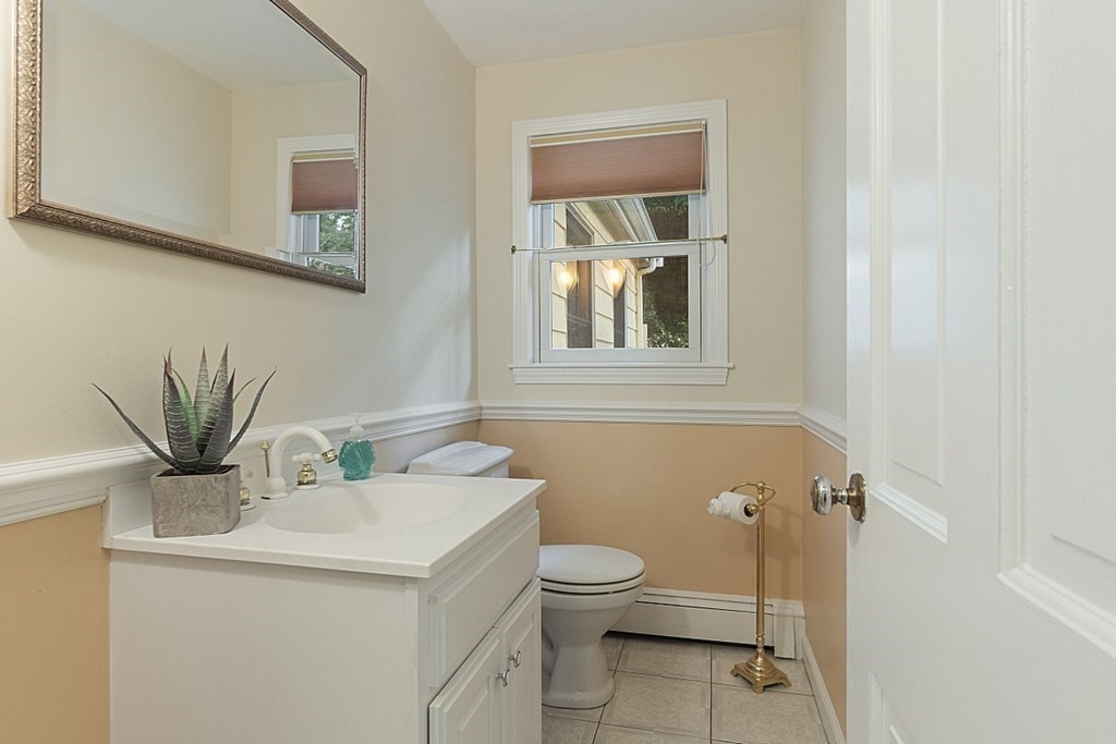 5 Alpine Circle Wakefield, MA 01880 - Photo 17 of 42 a bathroom with a toilet a sink and mirror