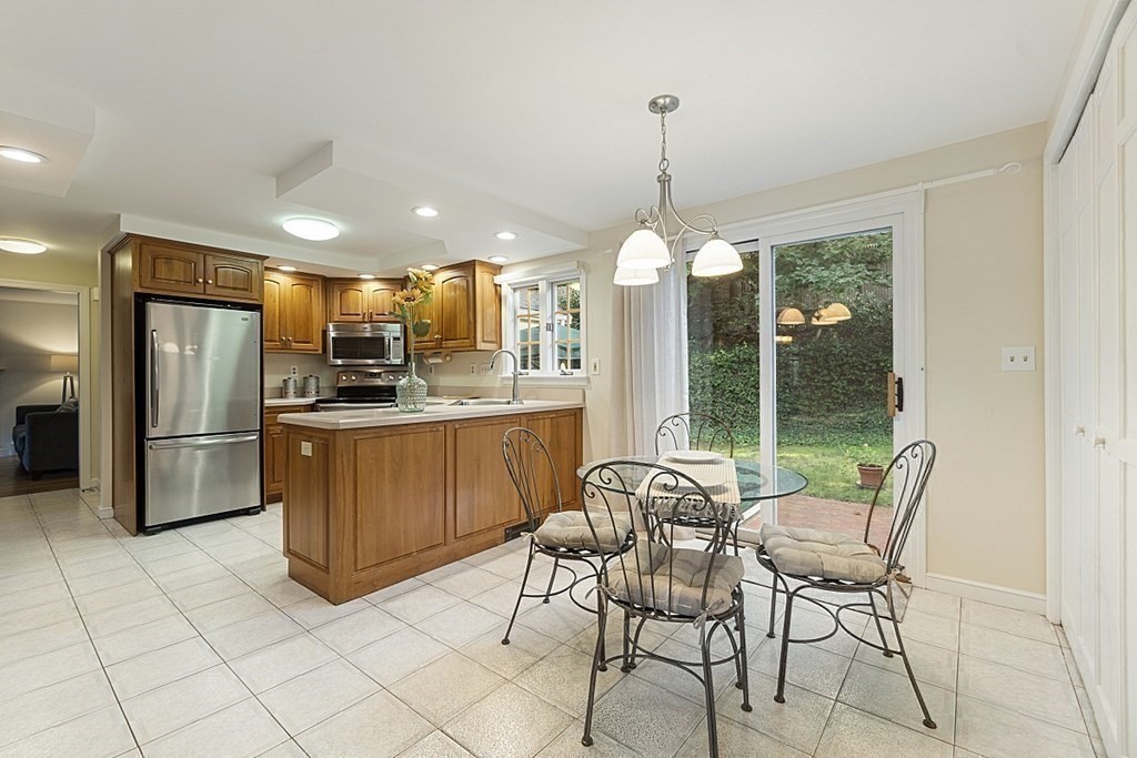 5 Alpine Circle Wakefield, MA 01880 - Photo 20 of 42 a kitchen with stainless steel appliances granite countertop a refrigerator and a stove top oven