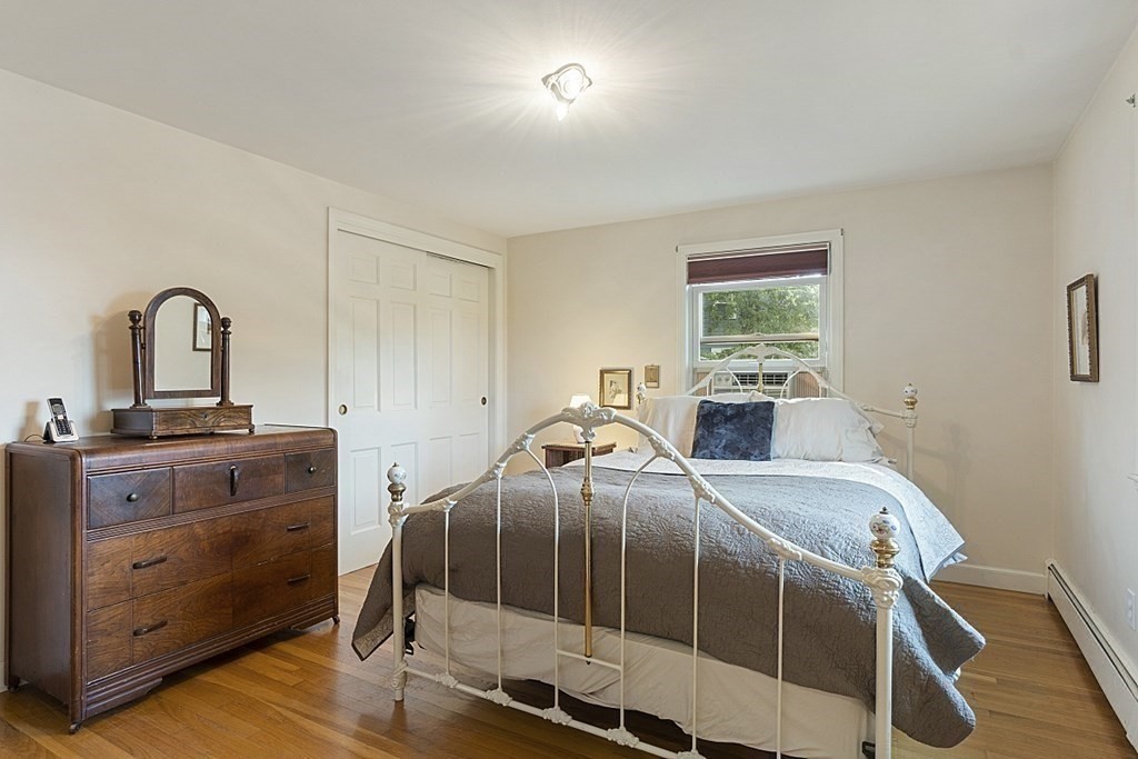 5 Alpine Circle Wakefield, MA 01880 - Photo 26 of 42 a bedroom with a bed and a dresser