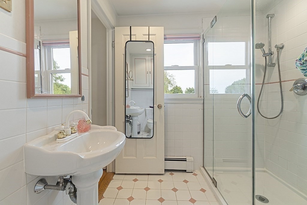 5 Alpine Circle Wakefield, MA 01880 - Photo 28 of 42 a bathroom with a sink a mirror and a shower