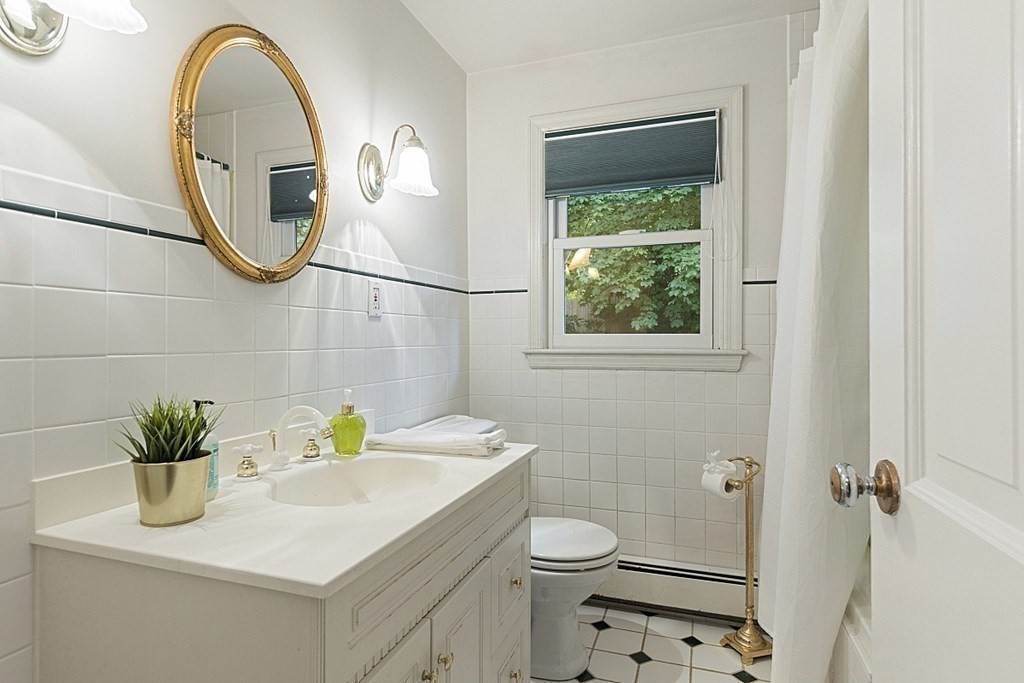 5 Alpine Circle Wakefield, MA 01880 - Photo 35 of 42 a bathroom with a sink a toilet and a mirror