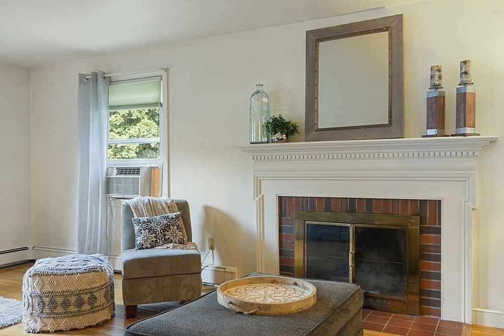 5 Alpine Circle Wakefield, MA 01880 - Photo 10 of 42 a living room with furniture and a fireplace