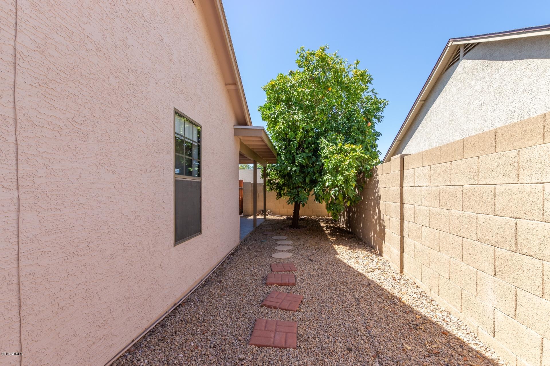4812 East Gary Street Mesa, AZ 85205 - Photo 36 of 37 a view of a pathway with a house in the background