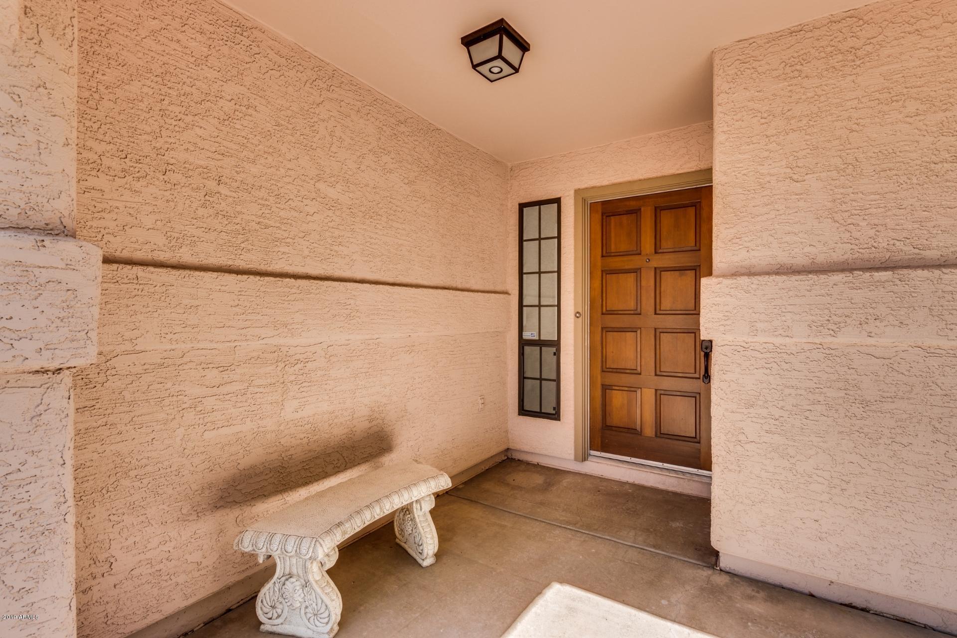 4812 East Gary Street Mesa, AZ 85205 - Photo 7 of 37 a bathroom with a window and a toilet