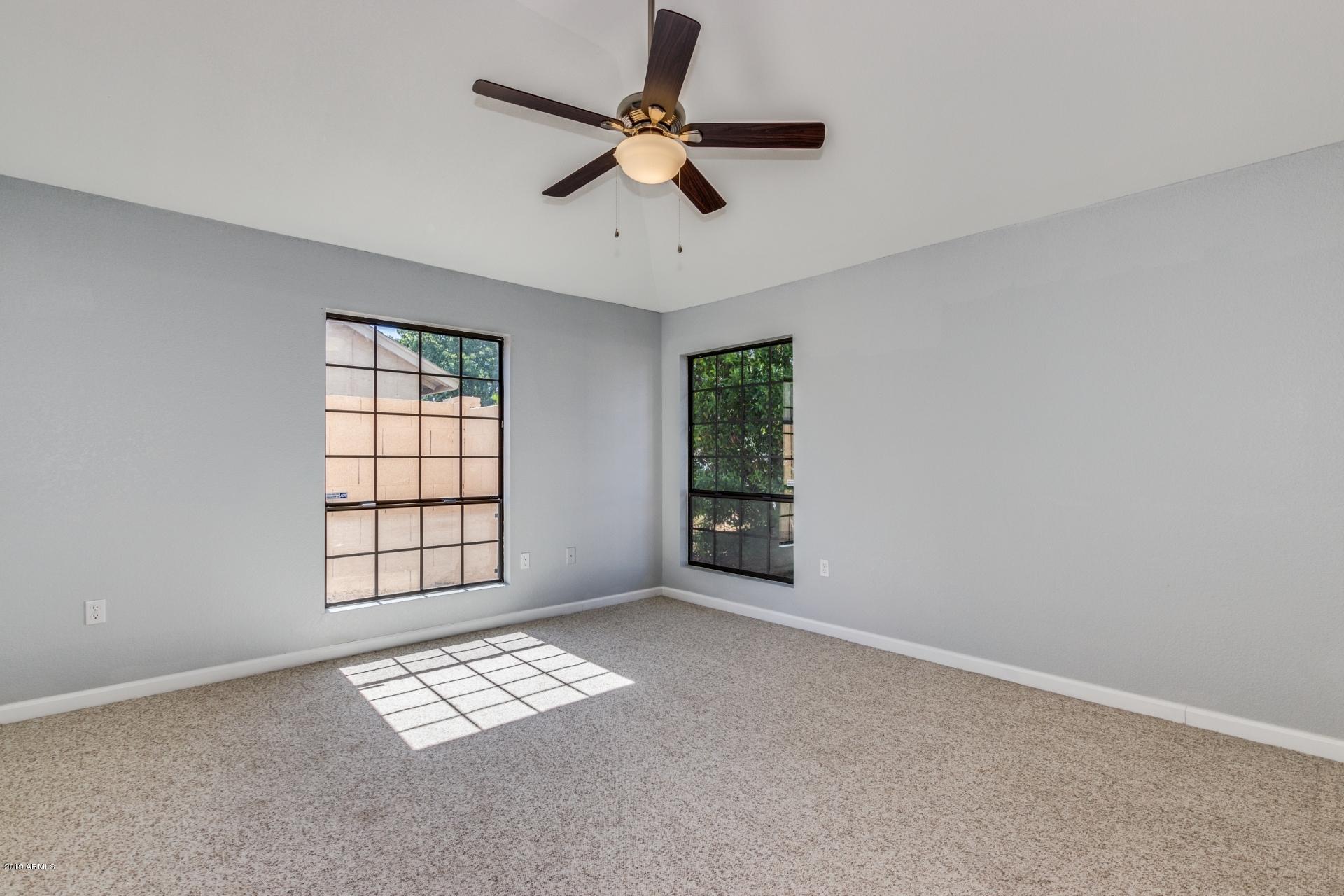4812 East Gary Street Mesa, AZ 85205 - Photo 9 of 37 a view of an empty room with a window