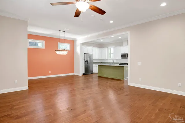 a view of kitchen with a sink and a refrigerator