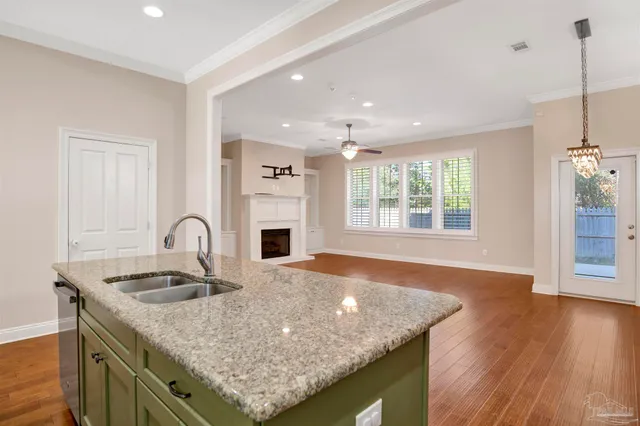 a kitchen with a sink and stove